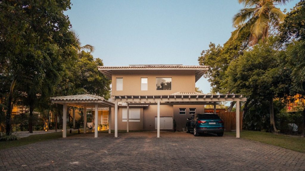 Modern house with carport and car parked outside.