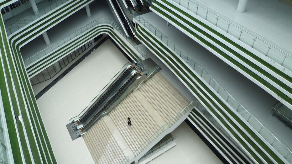 an overhead view of an escalator in a building