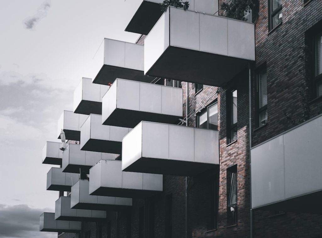 a tall building with balconies on the side of it